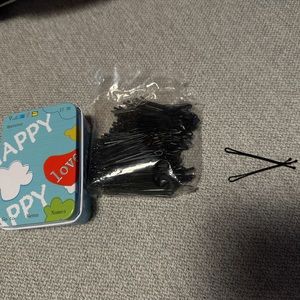 A box of black hair bins